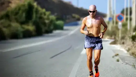 Shirtless man jogging outdoors for improved fitness and testosterone health